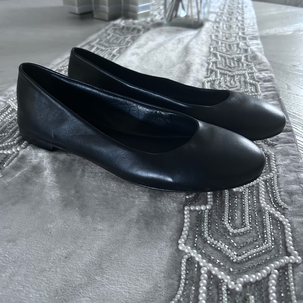 Tamara Mellon Classic Black Leather Flat w/ Minnetonka Lt pink Canvas Flat.